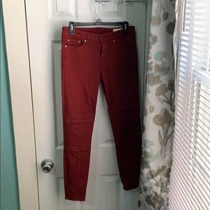 Red form fitting jeans